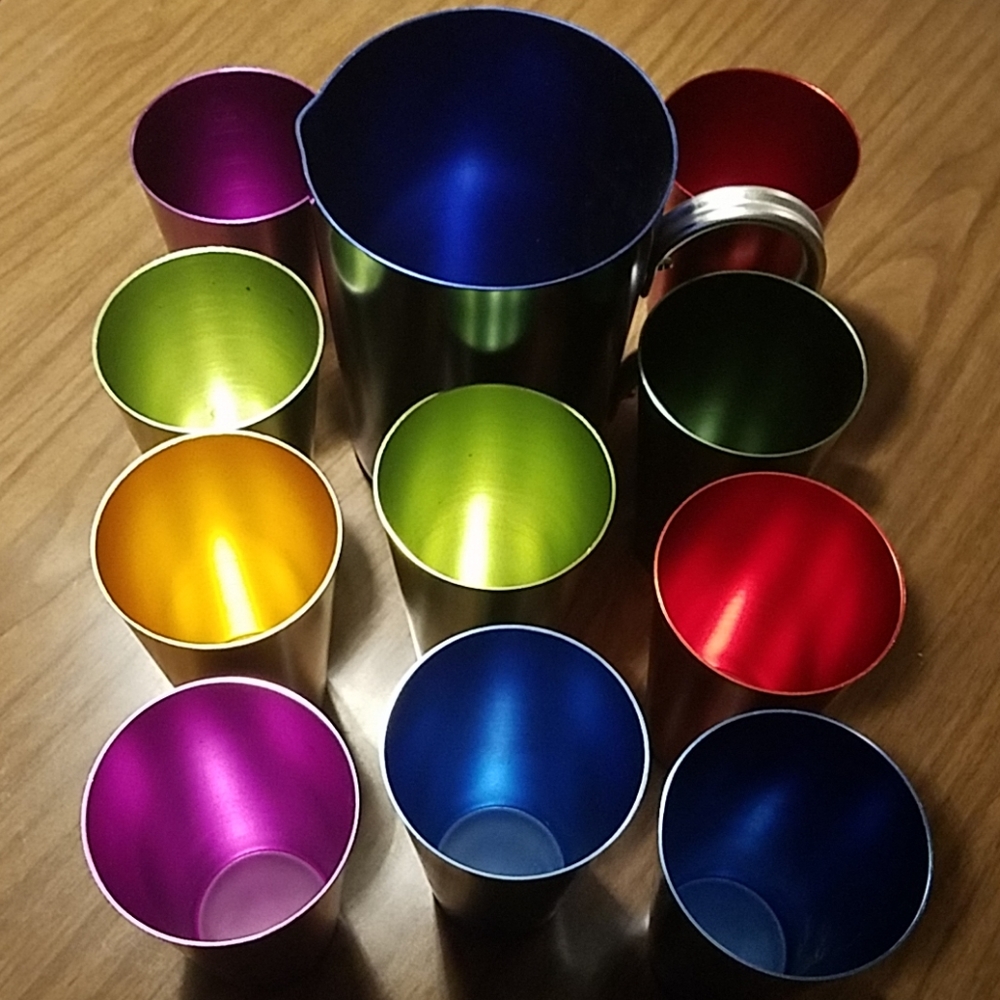 Metal pitcher and metal cups.
